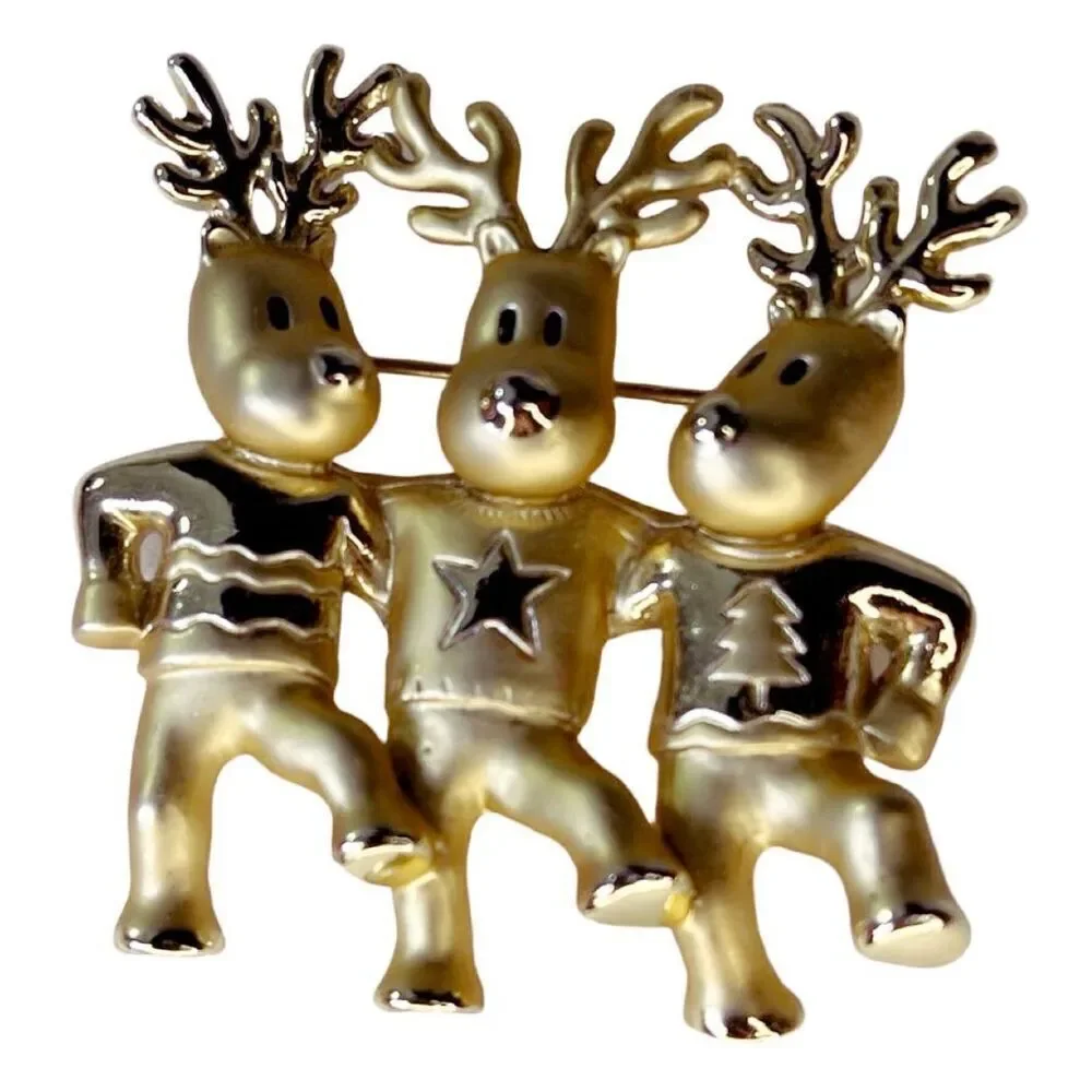 Vintage AJC three dancing deer gold tone brooch.
